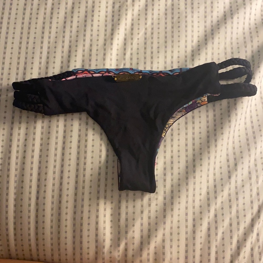 Never worn, reversible, braided side thong.
